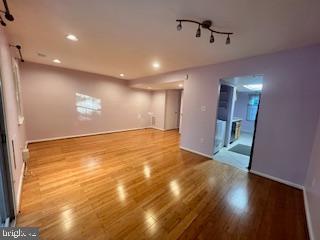 9218 Sprucewood Road Burke, VA 22015 - Photo 9 of 33 Spacious, sunlit room with elegant flooring.