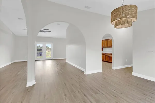 a view of livingroom and kitchen with wooden floor