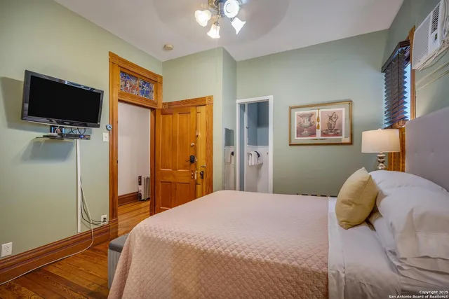 a bedroom with a bed and a couch