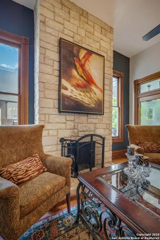 a bedroom with furniture and a fireplace