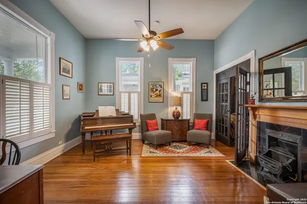 a living room with furniture and a fireplace