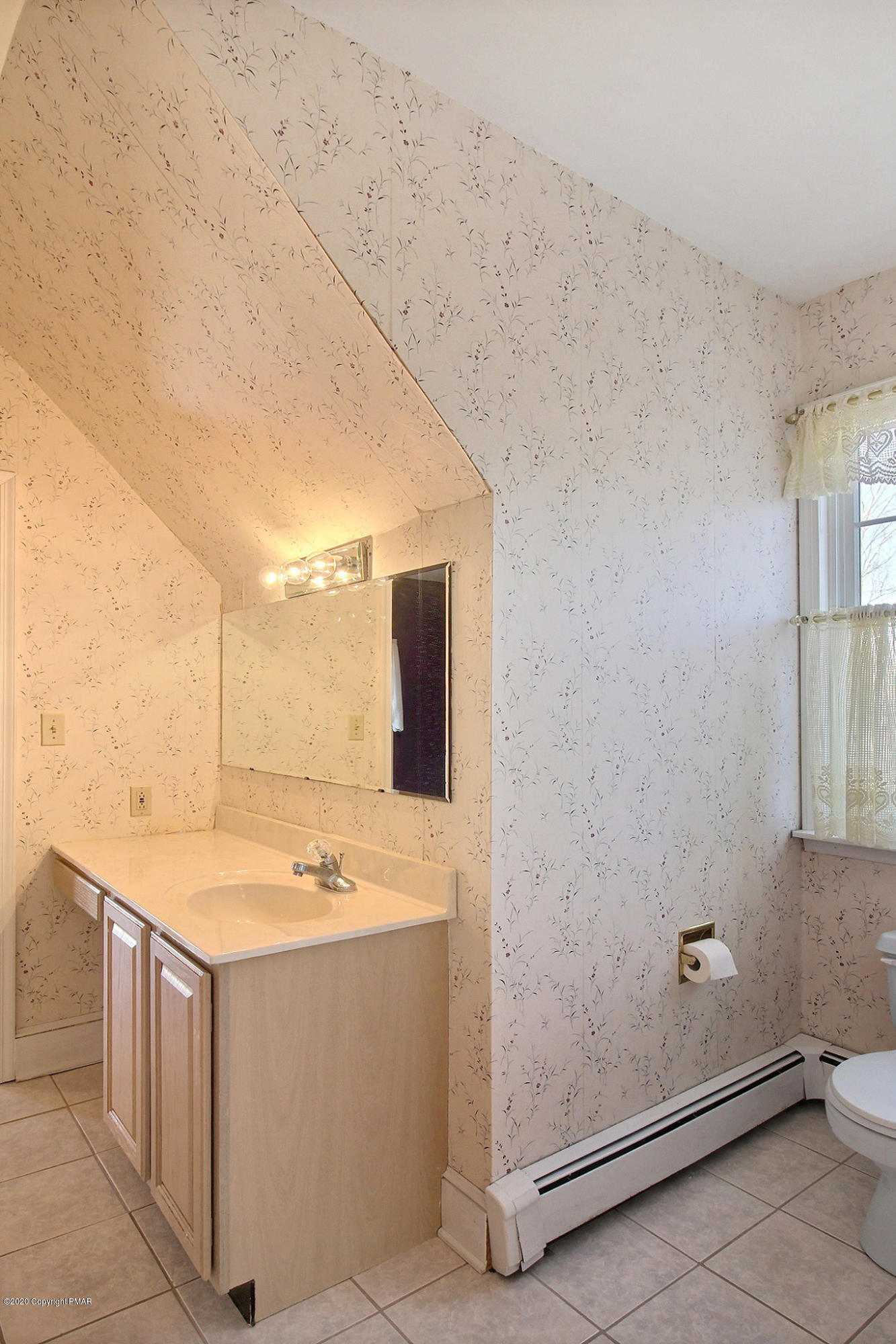 5875 Cherry Valley Road Stroudsburg, PA 18360 - Photo 54 of 65 a bathroom with a sink and a mirror