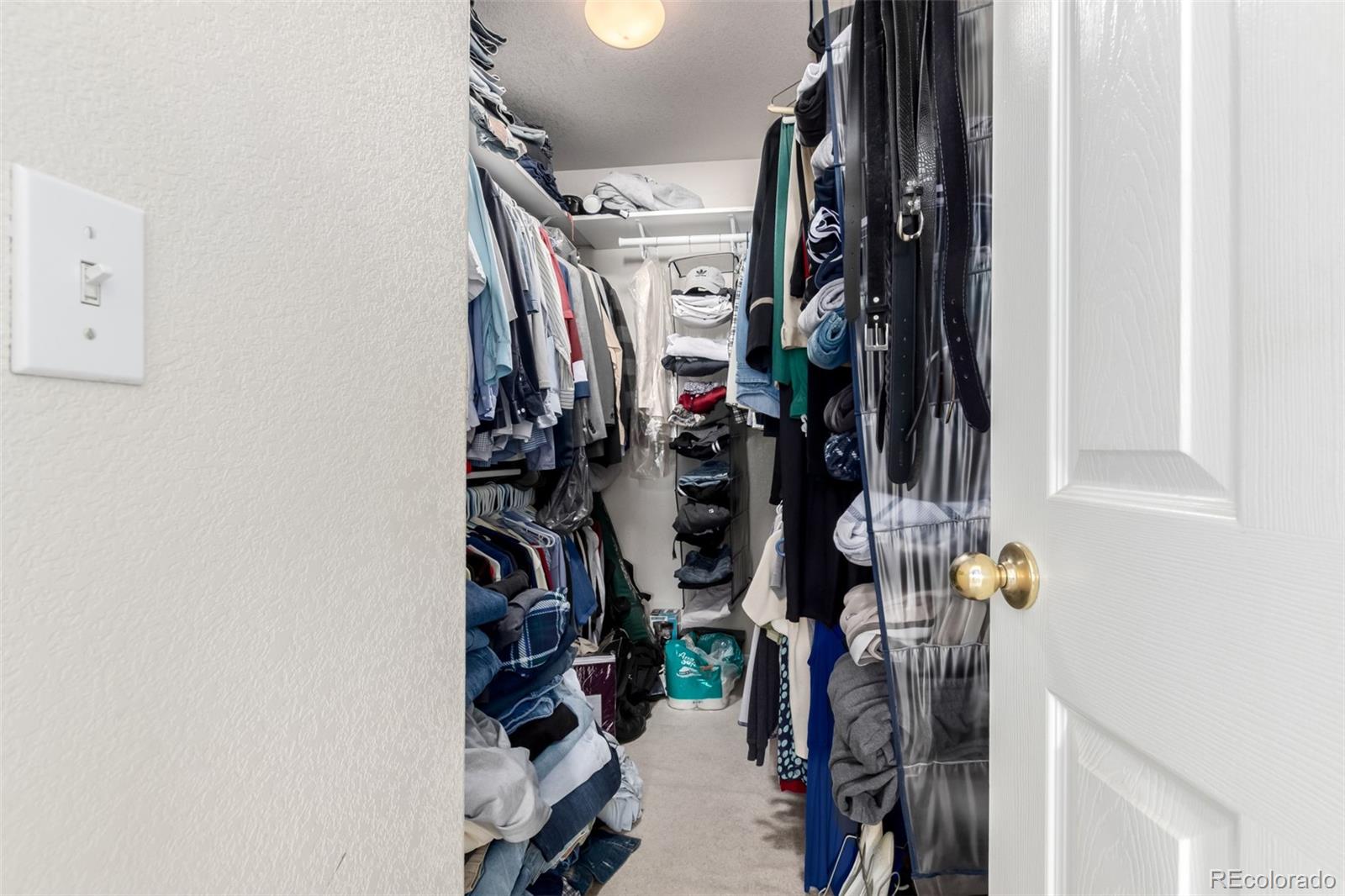 6542 Silverleaf Court Firestone, CO 80504 - Photo 12 of 18 a view of walk in closet with clothes
