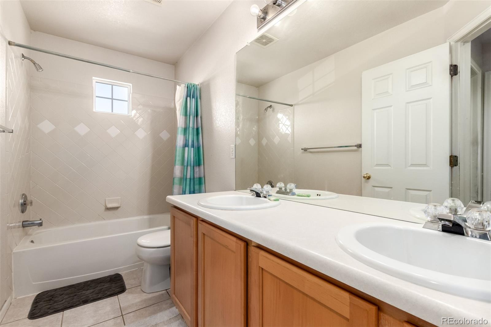 6542 Silverleaf Court Firestone, CO 80504 - Photo 15 of 18 a bathroom with a sink a toilet and shower