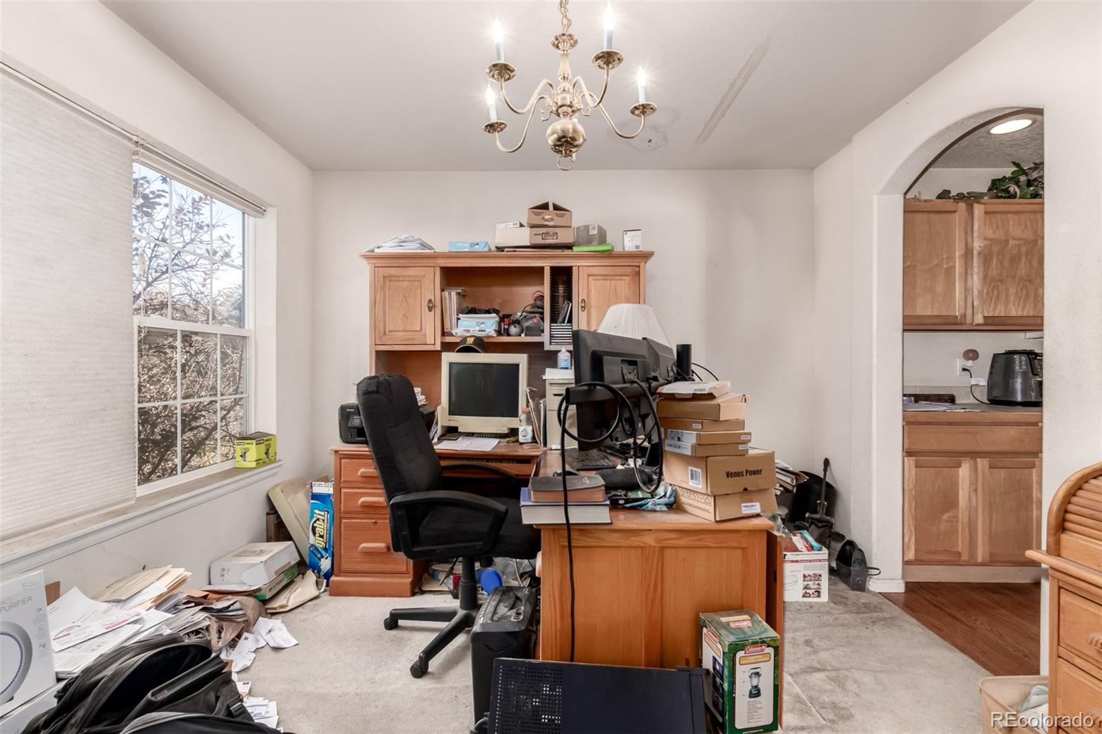 6542 Silverleaf Court Firestone, CO 80504 - Photo 6 of 18 a view of a workspace with furniture and a window