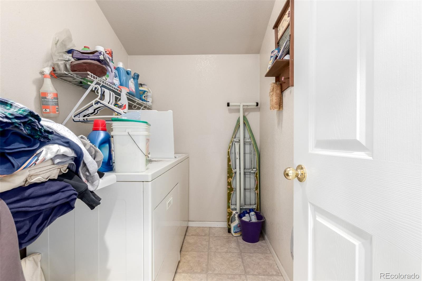 6542 Silverleaf Court Firestone, CO 80504 - Photo 8 of 18 a view of walk in closet with clothes and shoes