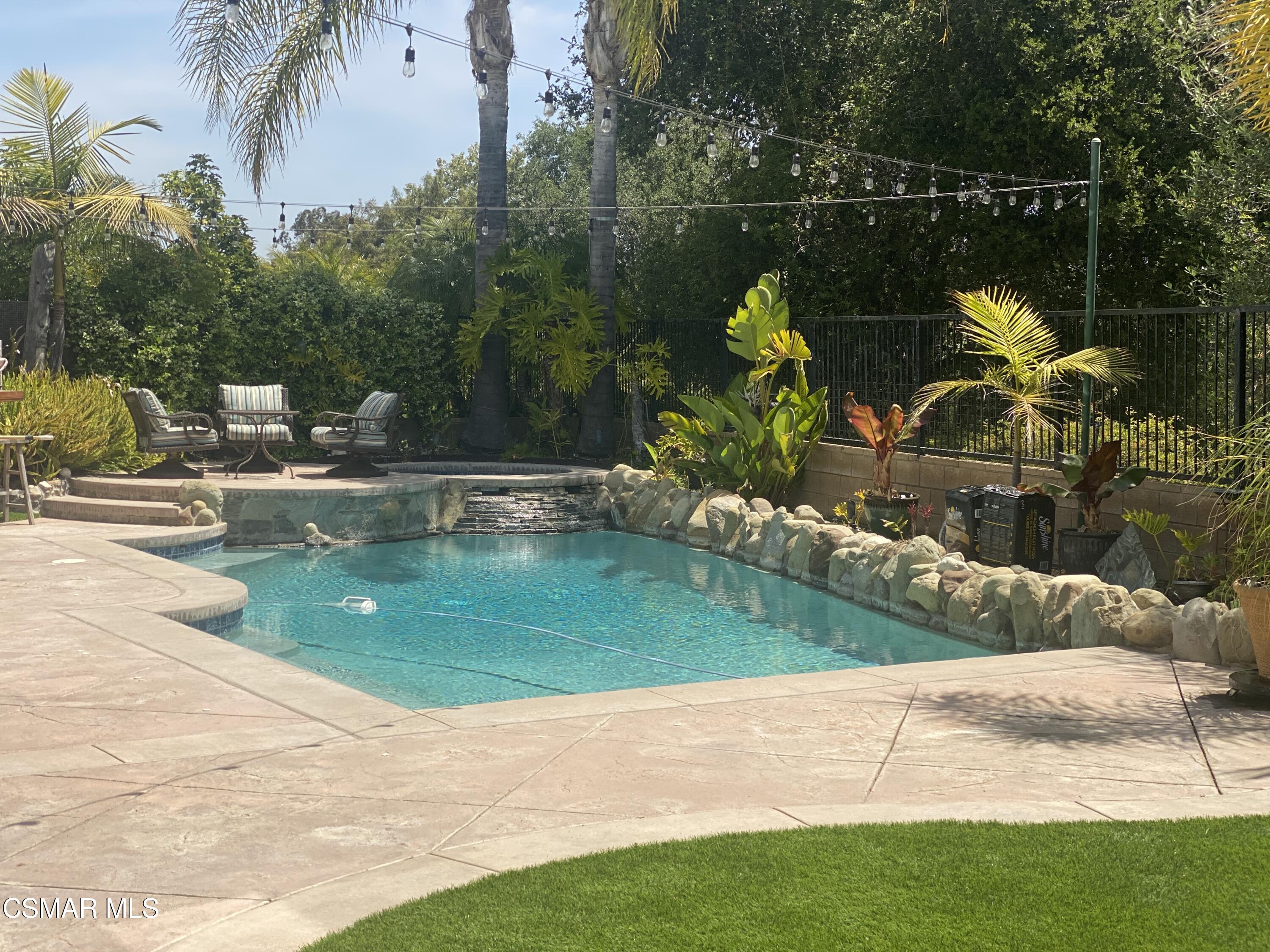 a view of a swimming pool with a patio
