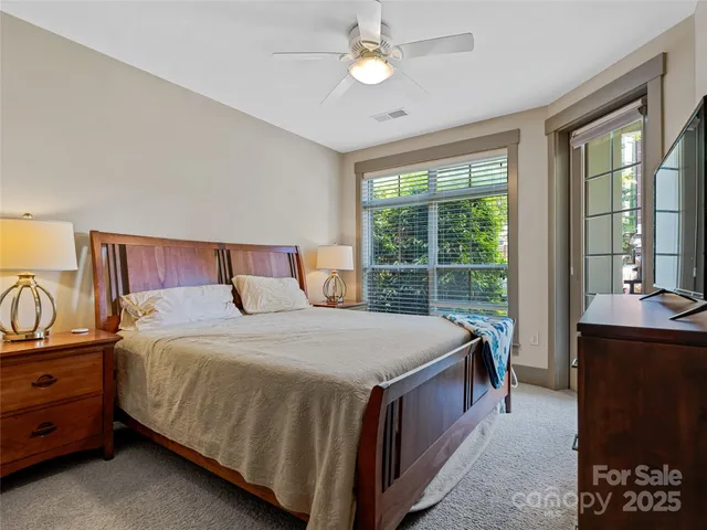 a bedroom with a bed dresser and a window