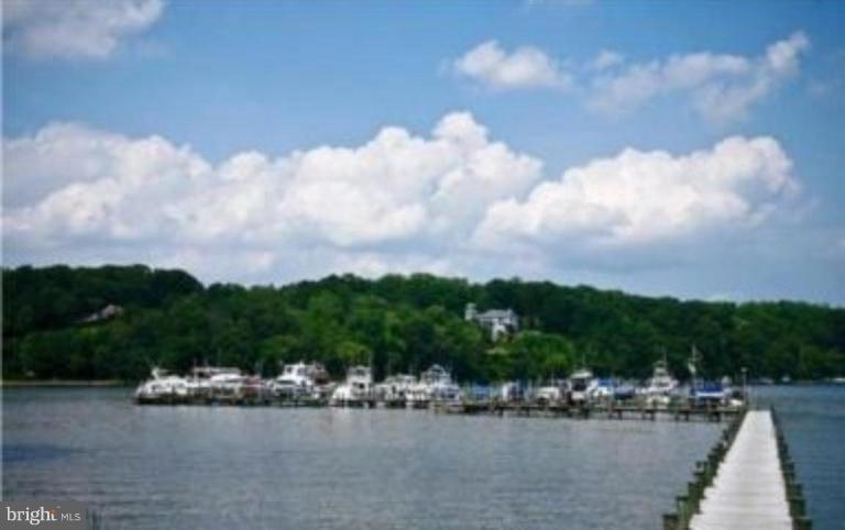 686 Discovery Road Davidsonville, MD 21035 - Photo 25 of 30 a view of a lake with houses in back