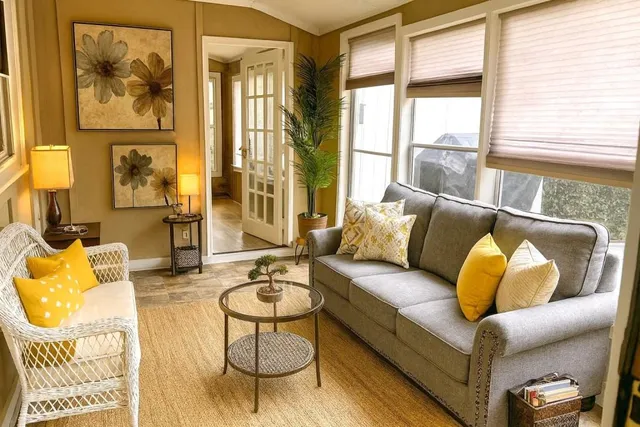 a living room with furniture and a large window