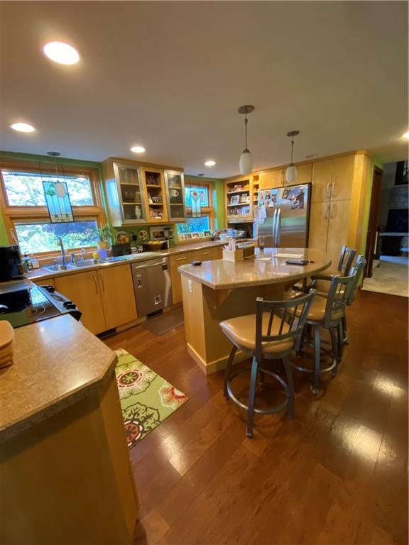 Lovely, spacious kitchen with island/breakfast bar area with hardwood flooring