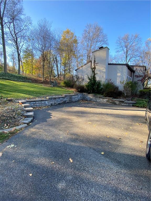 2300 Robbins Station Road North Huntingdon, PA 15642 - Photo 24 of 24 Driveway entrance to home with 2 car detached garage with "basement" underneath garage. Great area for storage.