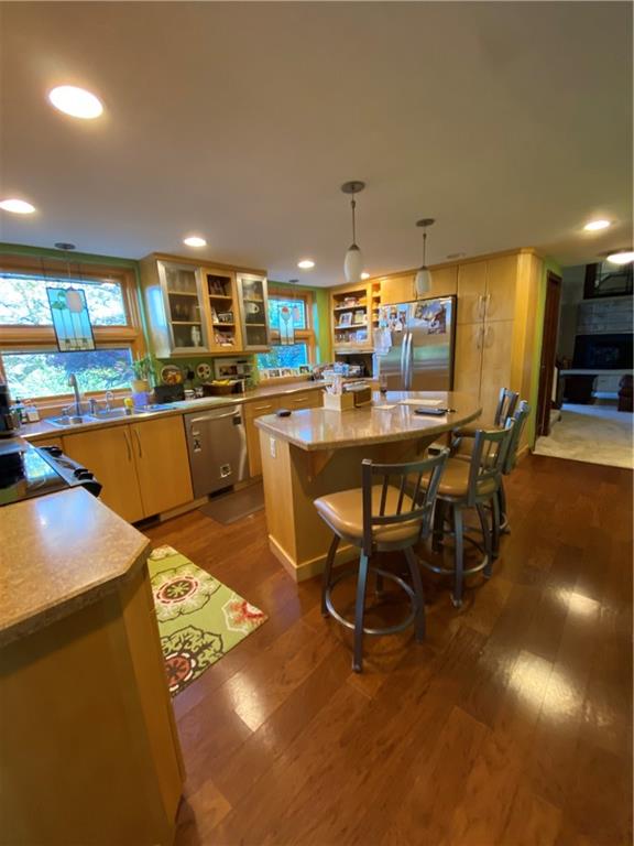 Kitchen area with lots of windows and counter space - all stainless steel appliances