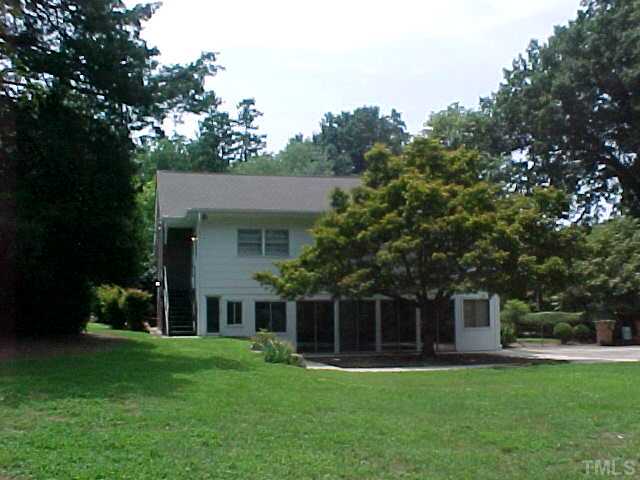 2512 Everett Avenue Raleigh, NC 27607 - Photo 4 of 7 a front view of a house with a garden and yard