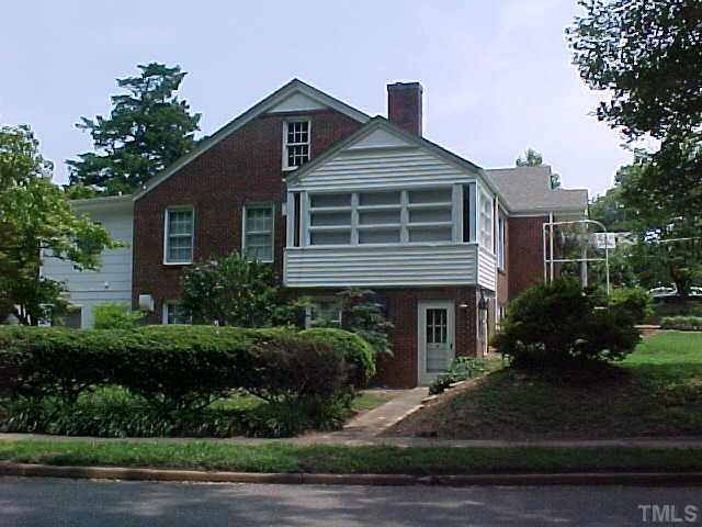 2512 Everett Avenue Raleigh, NC 27607 - Photo 6 of 7 a front view of a house with a yard