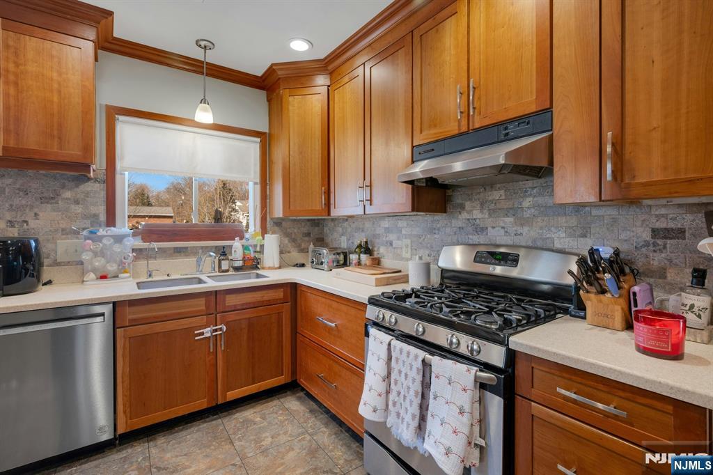 120 Meadowbrook Road Livingston, NJ 07039 - Photo 13 of 36 a kitchen with a sink cabinets and appliances