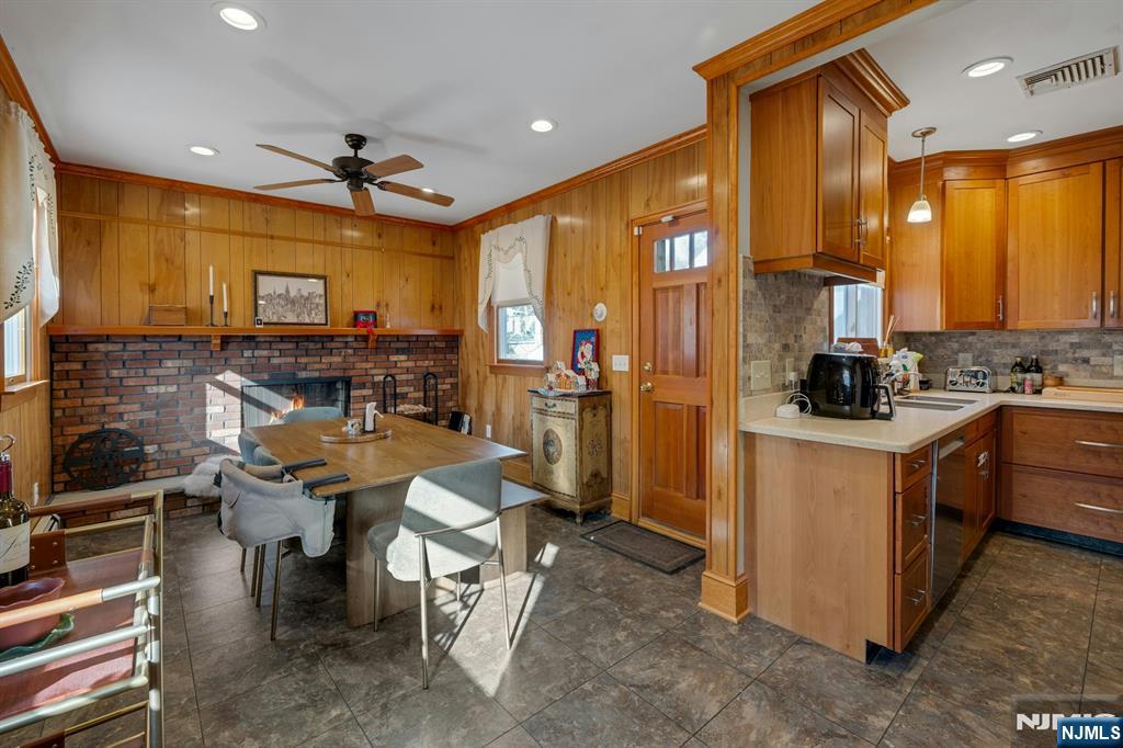 120 Meadowbrook Road Livingston, NJ 07039 - Photo 15 of 36 a kitchen with stainless steel appliances kitchen island granite countertop a stove top oven a sink and a refrigerator
