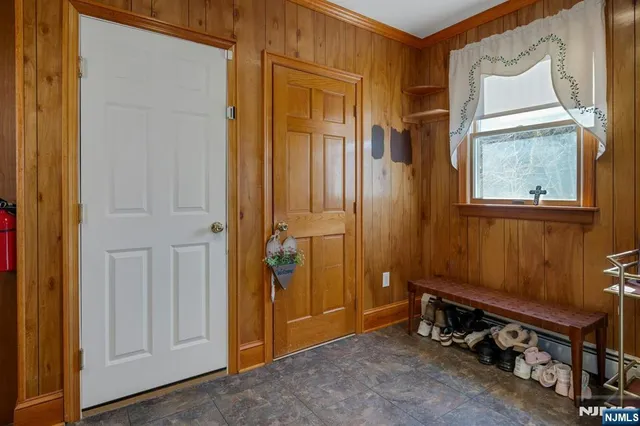 a room with furniture a rug toys and a window