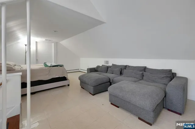 a living room with furniture gym equipment and a view of living room