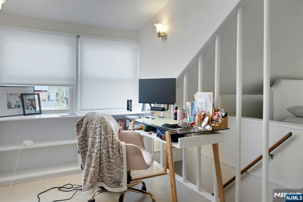 120 Meadowbrook Road Livingston, NJ 07039 - Photo 26 of 36 a living room with furniture and a flat screen tv