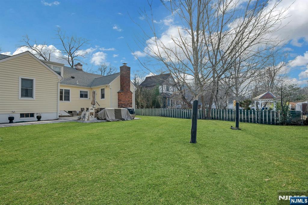120 Meadowbrook Road Livingston, NJ 07039 - Photo 35 of 36 a house view with a play ground in front of it