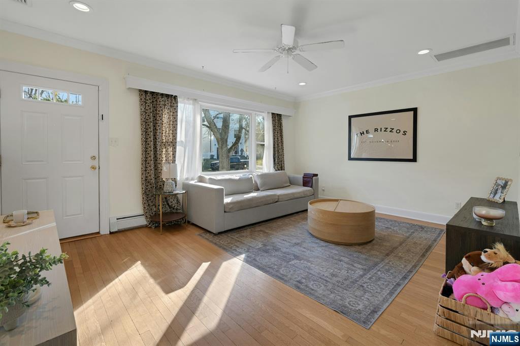 120 Meadowbrook Road Livingston, NJ 07039 - Photo 6 of 36 a living room with furniture and window