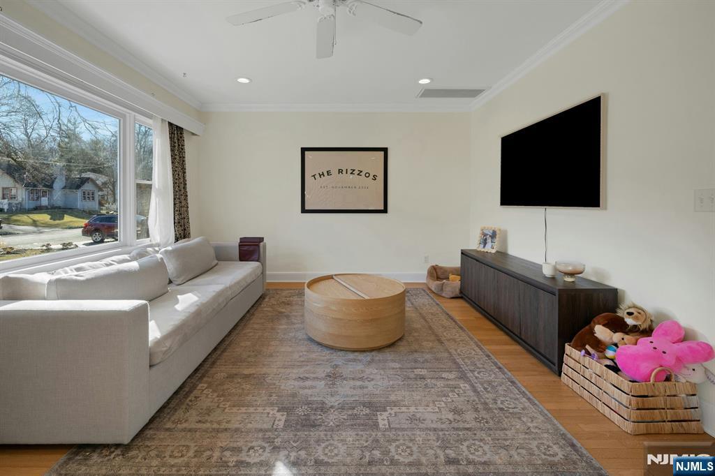 120 Meadowbrook Road Livingston, NJ 07039 - Photo 7 of 36 a living room with furniture and a flat screen tv