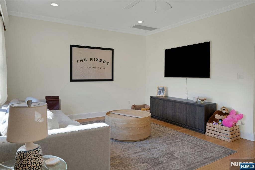 120 Meadowbrook Road Livingston, NJ 07039 - Photo 8 of 36 a living room with furniture and a flat screen tv