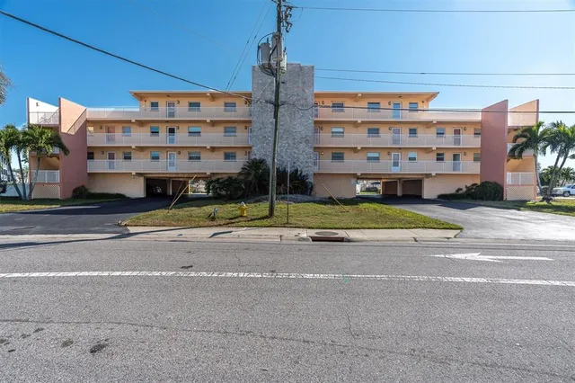 a view of building with yard in front of it