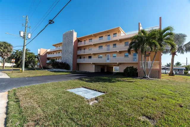 a front view of house with yard and trees