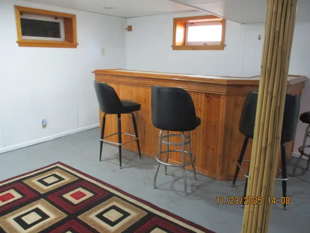 a living room with a couch and a bookshelf