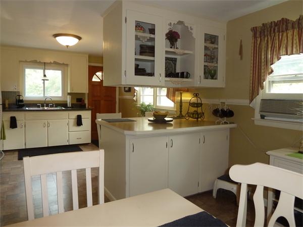56 Monson Road Brimfield, MA 01010 - Photo 2 of 25 a kitchen with a sink and cabinets