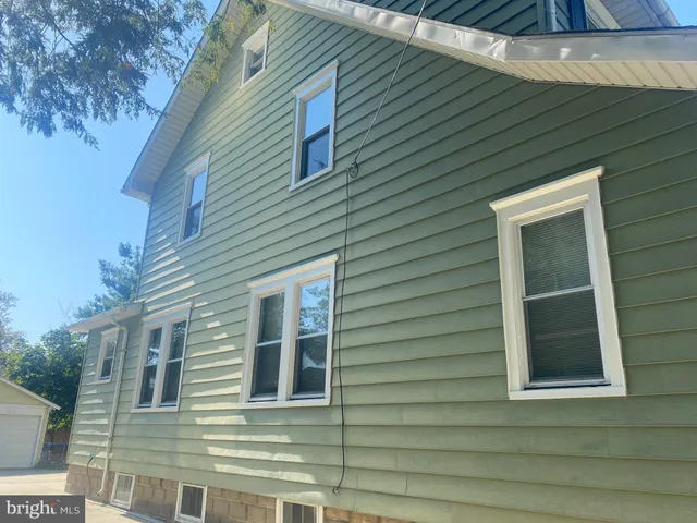 a view of a house with a door and a window