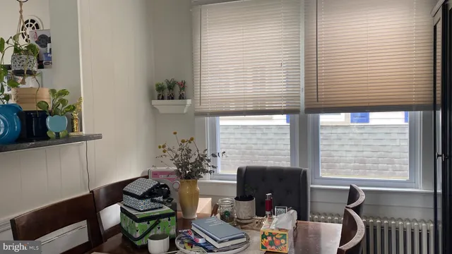 a view of living room with furniture and a potted plant