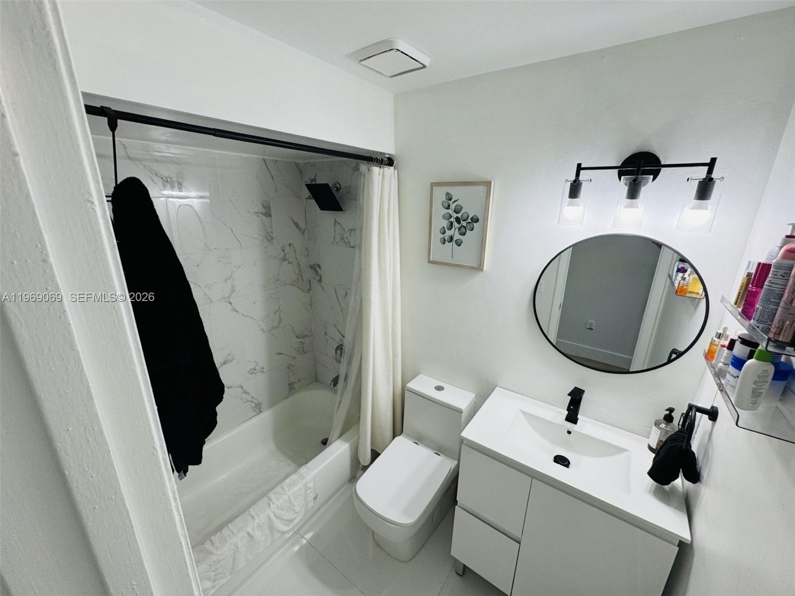 12853 Southwest 64th Lane Miami, FL 33183 - Photo 11 of 13 a bathroom with a sink toilet and shower