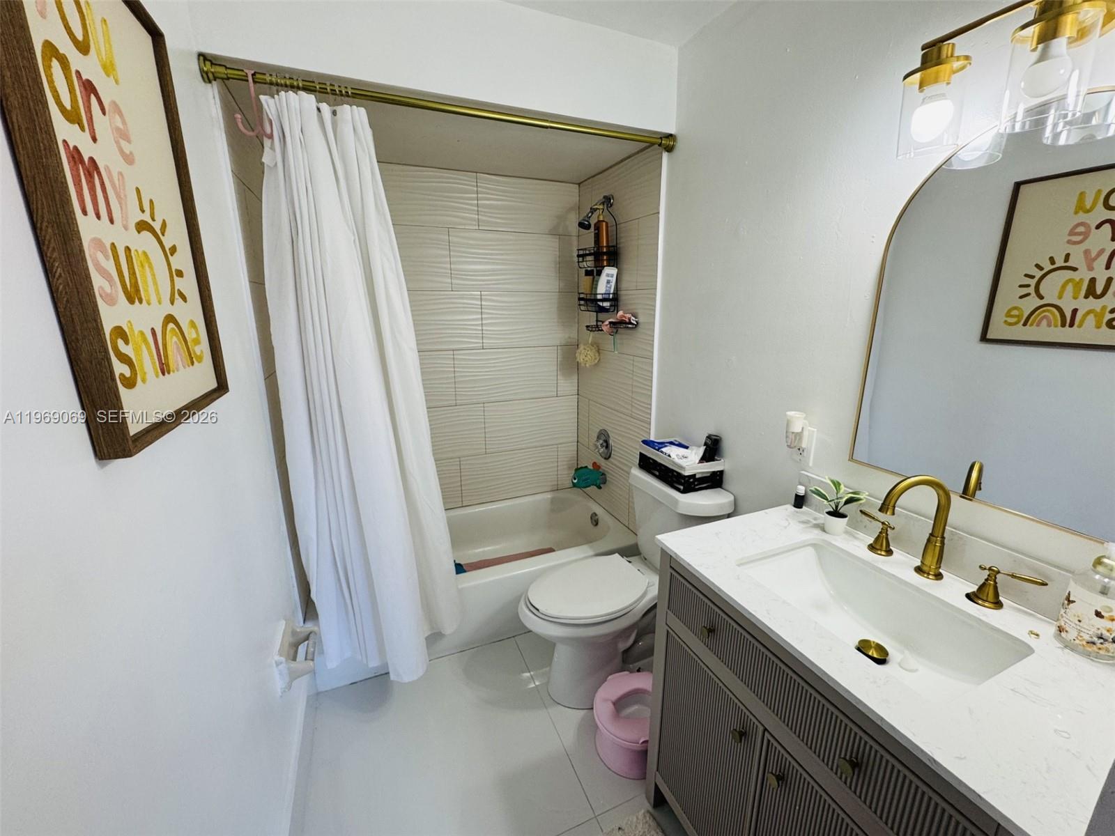 12853 Southwest 64th Lane Miami, FL 33183 - Photo 9 of 13 a bathroom with a sink and a mirror