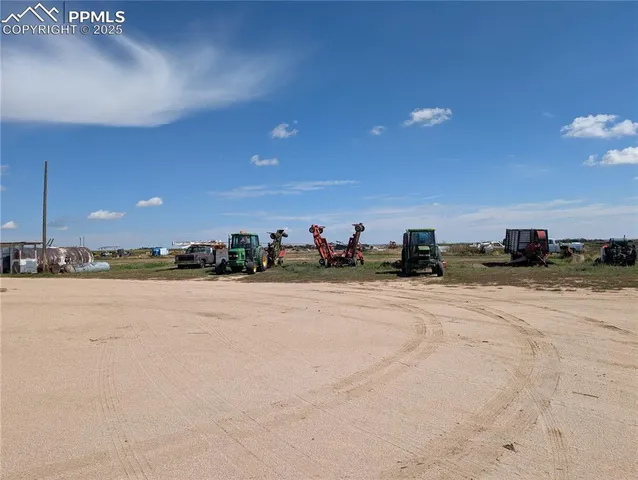 a view of a wooden deck with iron fence