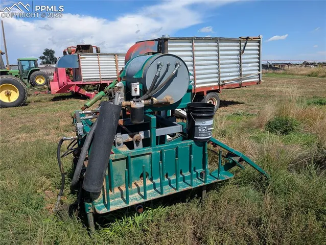 a view of residential houses with snow on the road