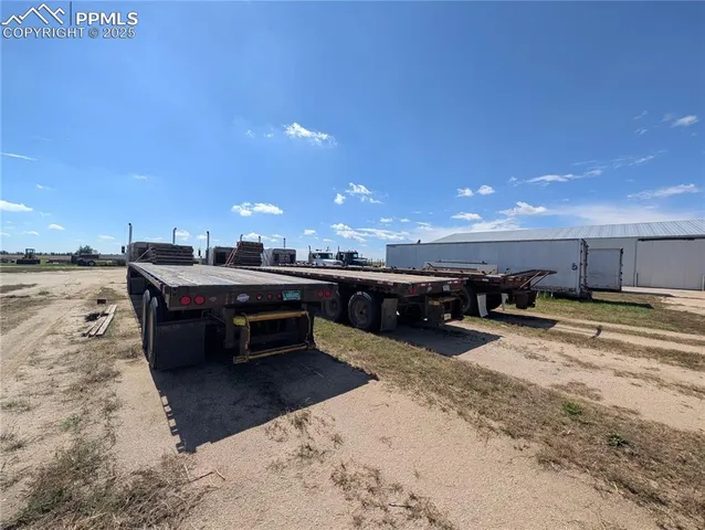 a view of a storage room with wooden floor