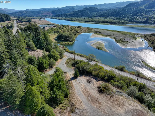 an aerial view of a house with a lake view