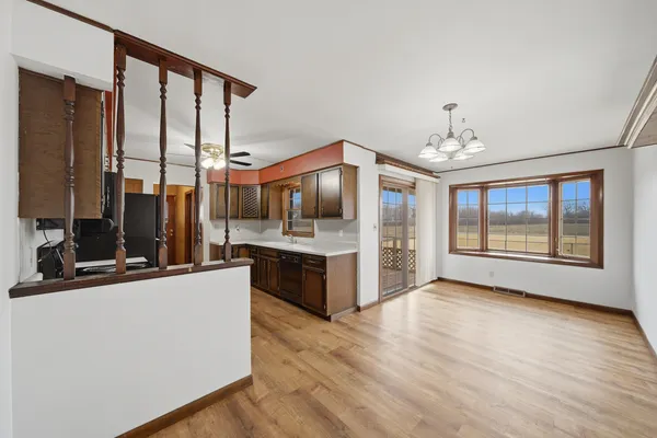 a kitchen with stainless steel appliances a sink dishwasher stove top oven and refrigerator