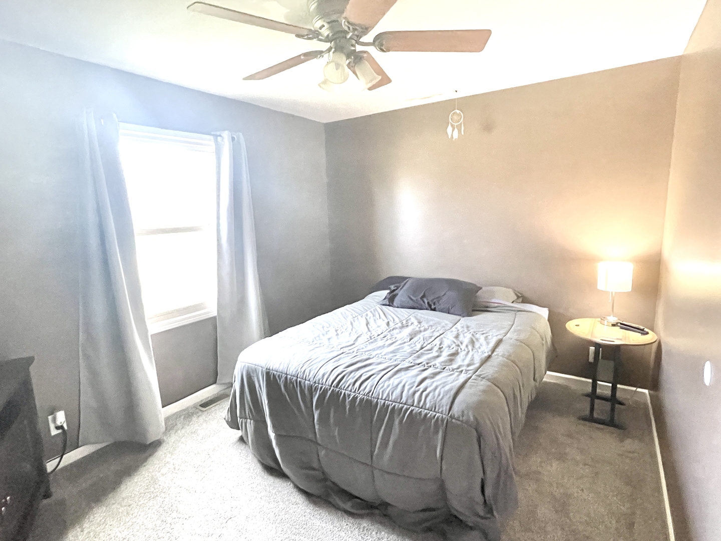 2867 East 752nd Road Utica, IL 61373 - Photo 11 of 23 a bedroom with a bed and window