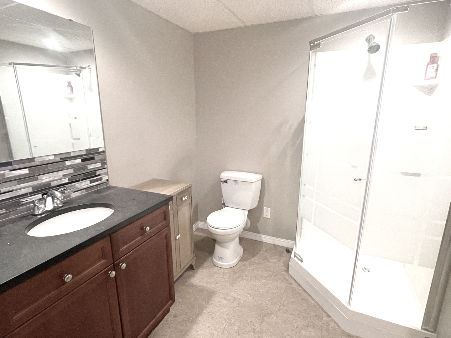 2867 East 752nd Road Utica, IL 61373 - Photo 16 of 23 a bathroom with a granite countertop sink toilet and shower