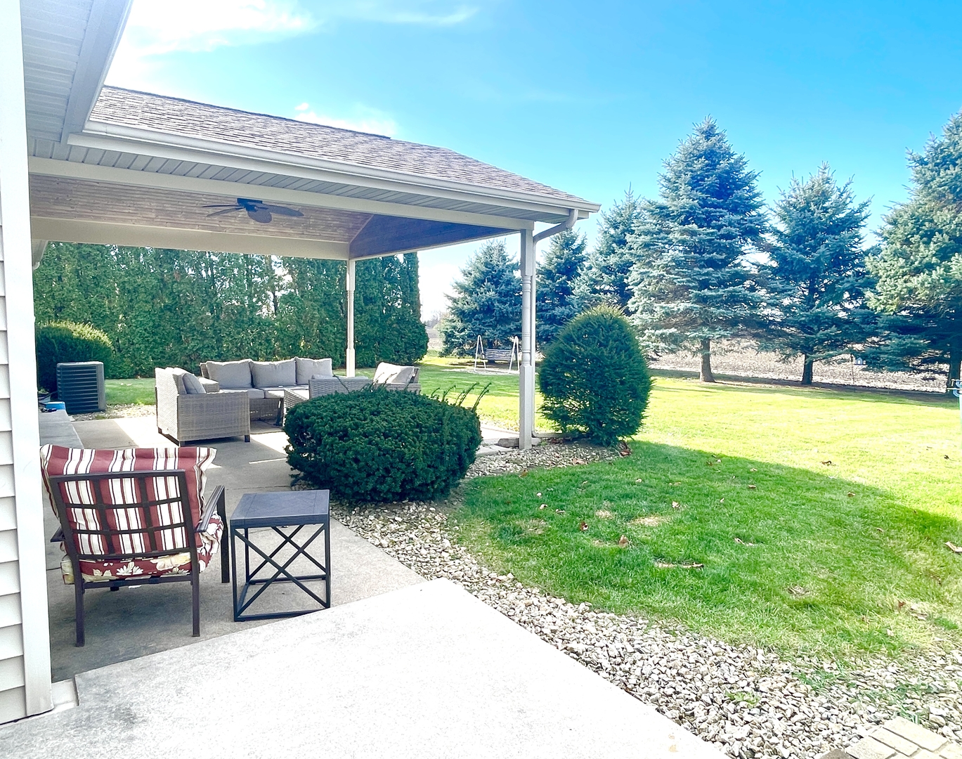 2867 East 752nd Road Utica, IL 61373 - Photo 18 of 23 a view of a chairs and table in patio with a backyard