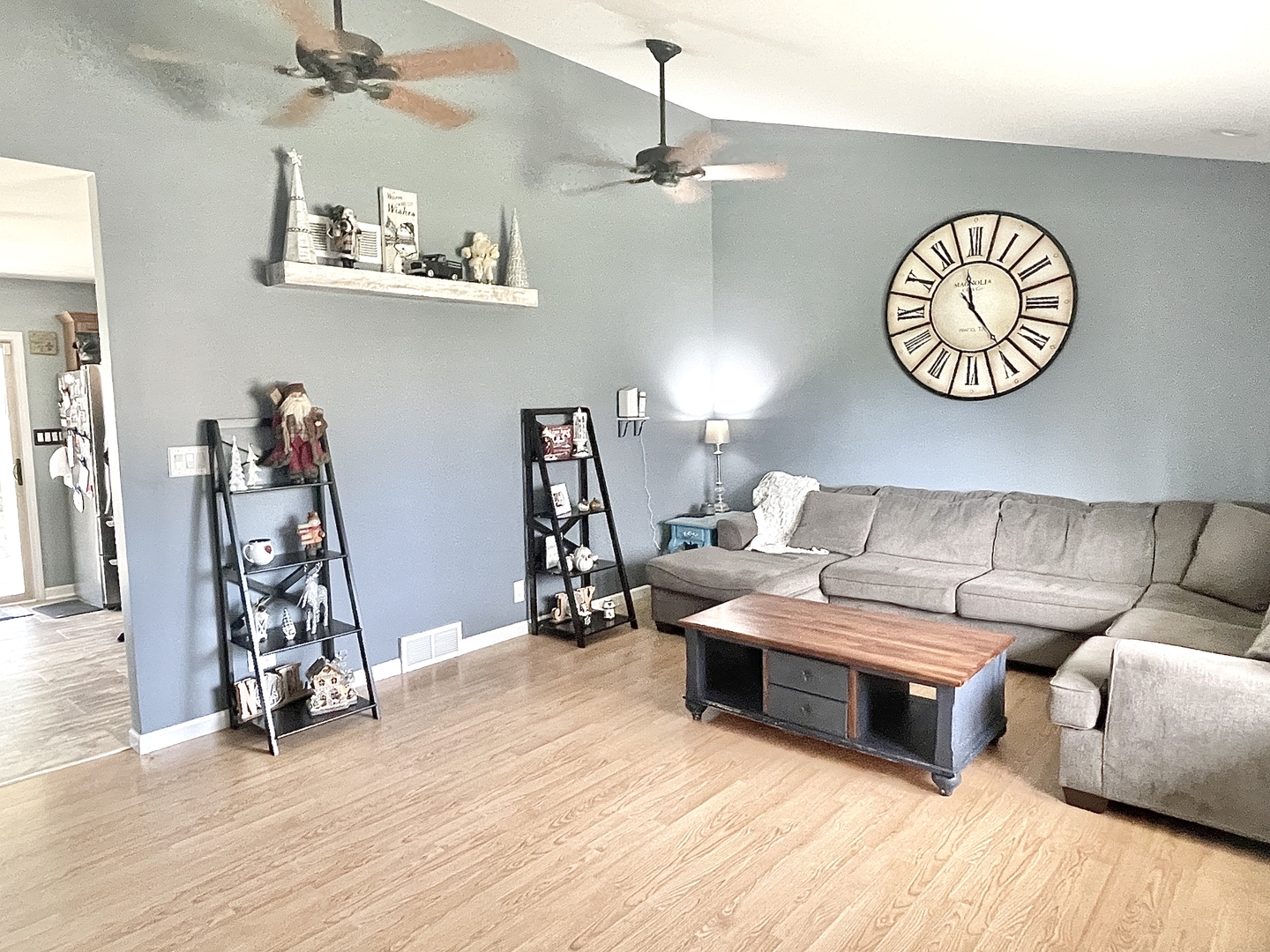 2867 East 752nd Road Utica, IL 61373 - Photo 4 of 23 a living room with furniture a clock and a window
