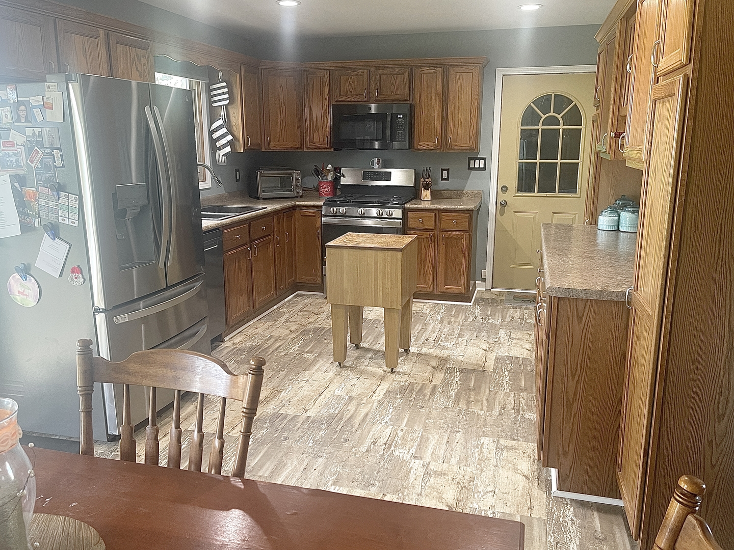 2867 East 752nd Road Utica, IL 61373 - Photo 6 of 23 a kitchen with granite countertop a refrigerator and a stove top oven