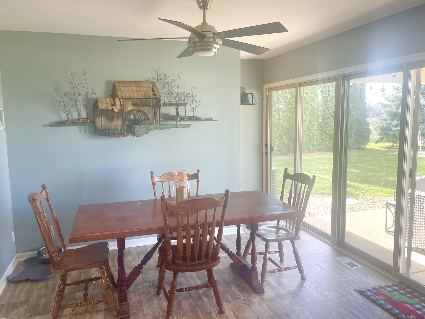 2867 East 752nd Road Utica, IL 61373 - Photo 7 of 23 a view of a dining room with furniture a chandelier and wooden floor