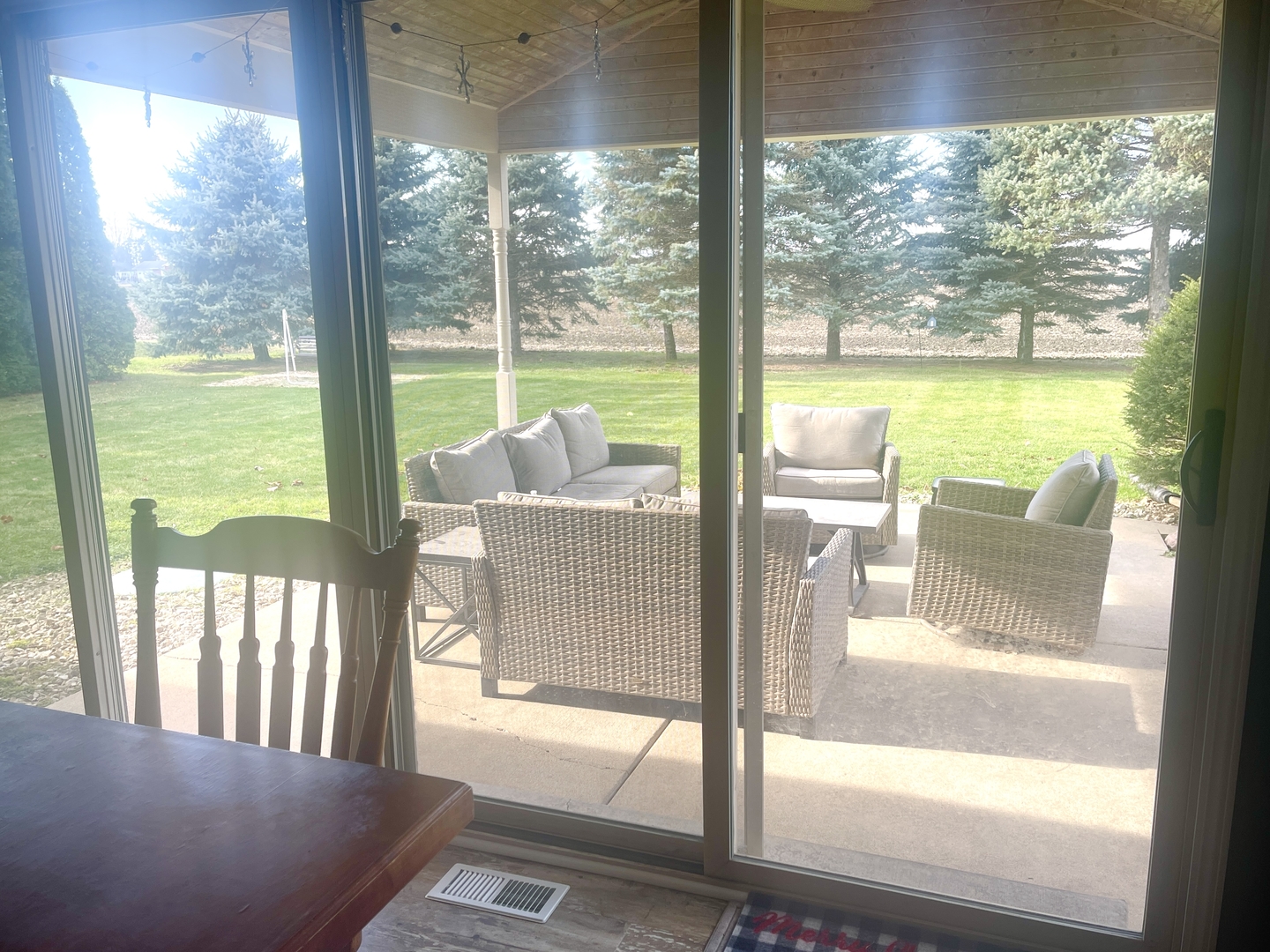 2867 East 752nd Road Utica, IL 61373 - Photo 8 of 23 a view of a city from a dining room with large windows