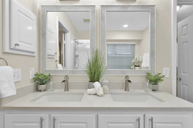 a bathroom with sink and mirror