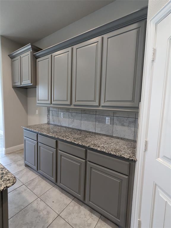 3741 Cecelia Lane Forest Hill, TX 76140 - Photo 5 of 16 a kitchen with granite countertop stainless steel appliances white cabinets granite counter tops and a wooden floors